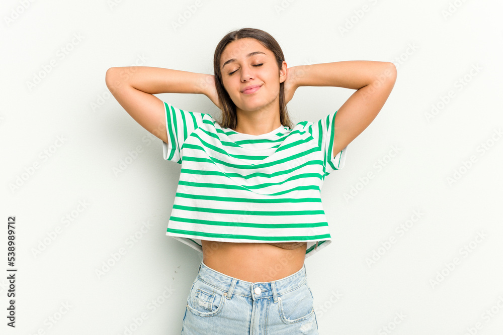 Young Indian woman isolated on white background feeling confident, with hands behind the head. Young Indian woman isolated on white background feeling confident, with hands behind the head.