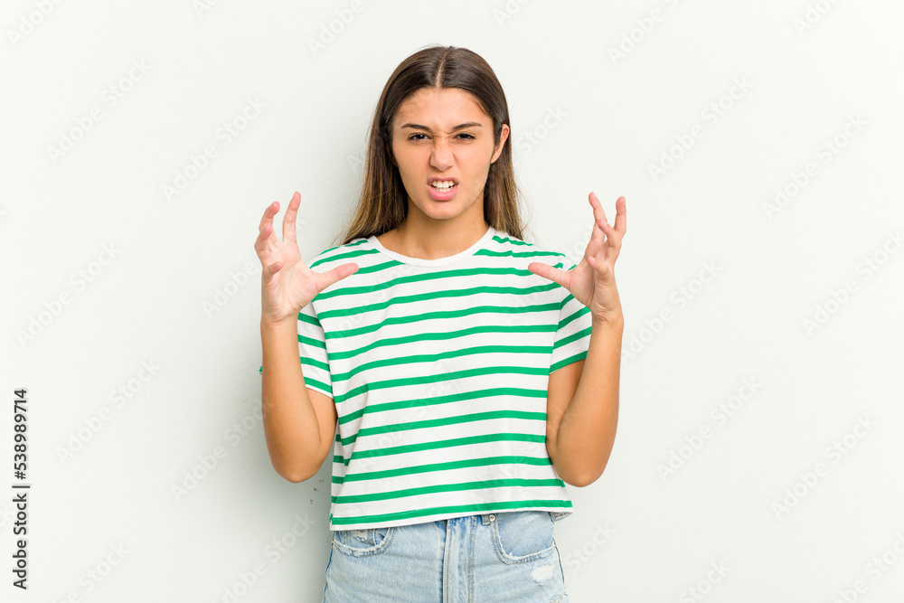 Young Indian woman isolated on white background screaming with rage.
