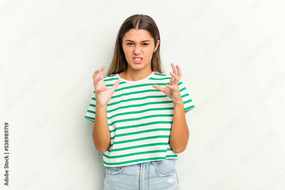 Young Indian woman isolated on white background upset screaming with tense hands. Young Indian woman isolated on white background upset screaming with tense hands.