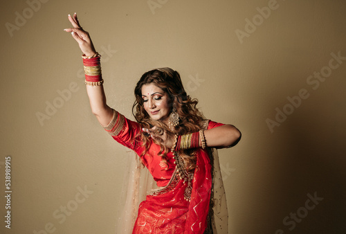 Color portrait of an indian kathak dancer moving hands  photo