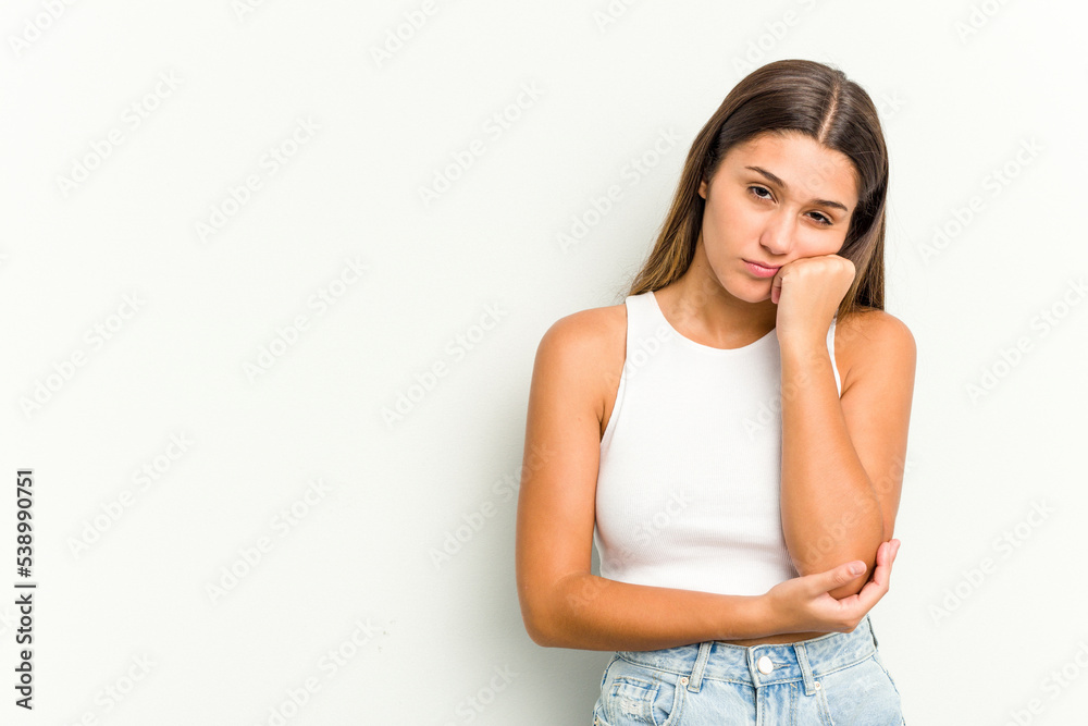 Young Indian woman isolated on white background who feels sad and pensive, looking at copy space. Young Indian woman isolated on white background who feels sad and pensive, looking at copy space.