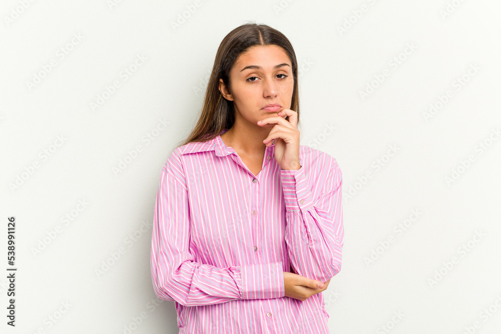 Young Indian woman isolated on white background thinking and looking up, being reflective, contemplating, having a fantasy. Young Indian woman isolated on white background thinking and looking up, being reflective, contemplating, having a fantasy.