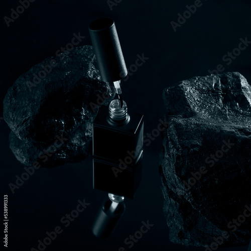 Nail polish bottle on black background. Professional product photo