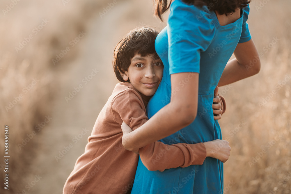 Fototapeta premium A brother hugging his sister