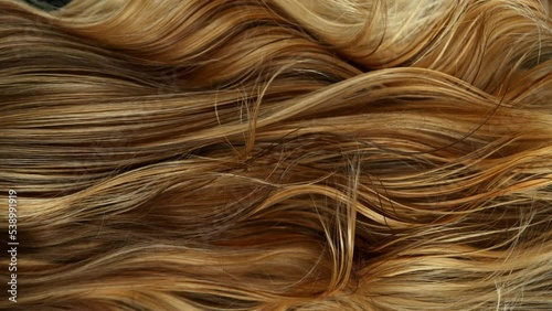 Super slow motion of wavy blonde hair in detail. Filmed on high speed cinema camera, 1000 fps. photo