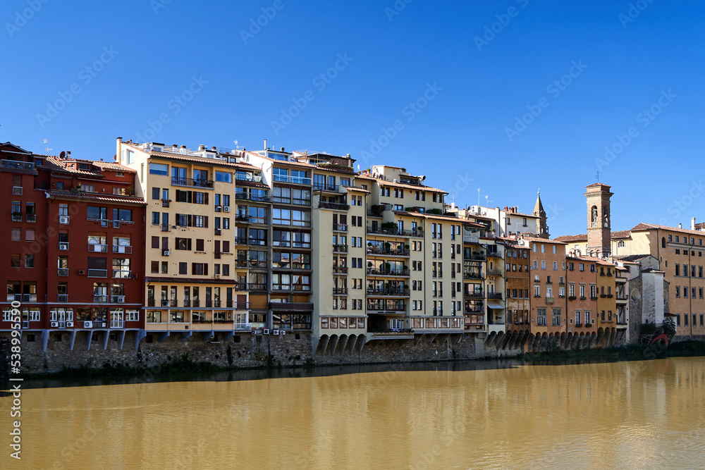Townhouses and historic buildings on the Arno River in the city of Florence