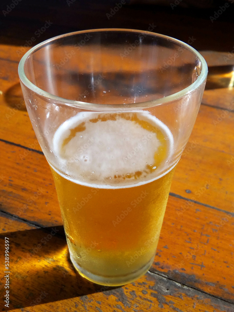 Glass of iced beer. Typical drink present in a happy hour in Brazil. Glass of iced beer. Typical drink present in a happy hour in Brazil.