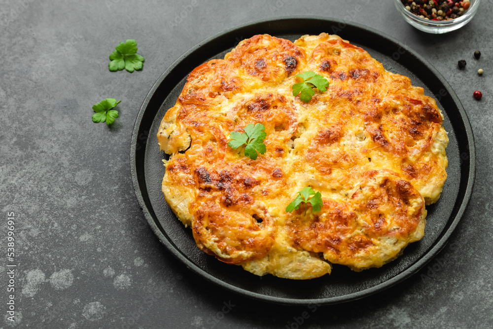 Baked cheddar ranch chicken, cheesy, vegetables in cast iron skillet. Top view, copy space, flat lay. Baked cheddar ranch chicken, cheesy, vegetables in cast iron skillet. Top view, copy space, flat lay.