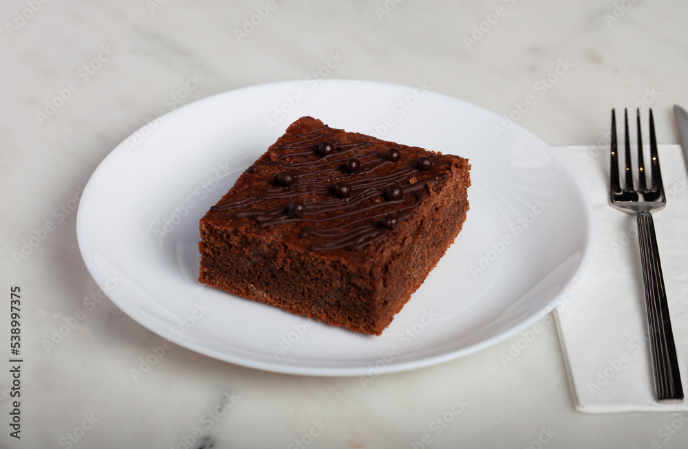 Browny Cake on a White Plate