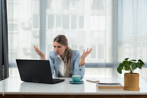 Frustrated annoyed woman confused by computer problem, annoyed businesswoman feels indignant about laptop crash, bad news online or disgusting video on web, stressed student looking at broken pc