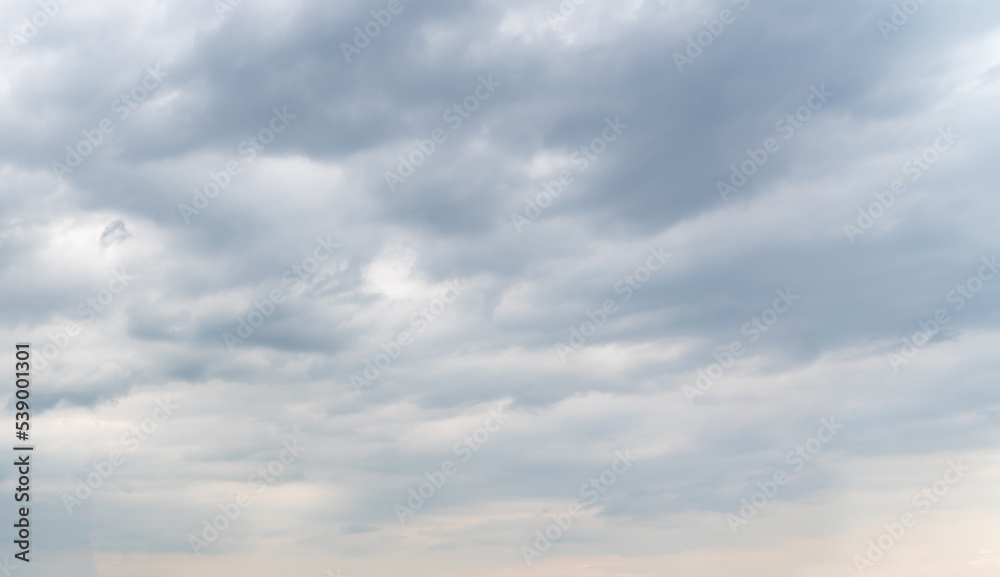 Smooth rows of gray clouds block out the sunlight Smooth rows of gray clouds block out the sunlight