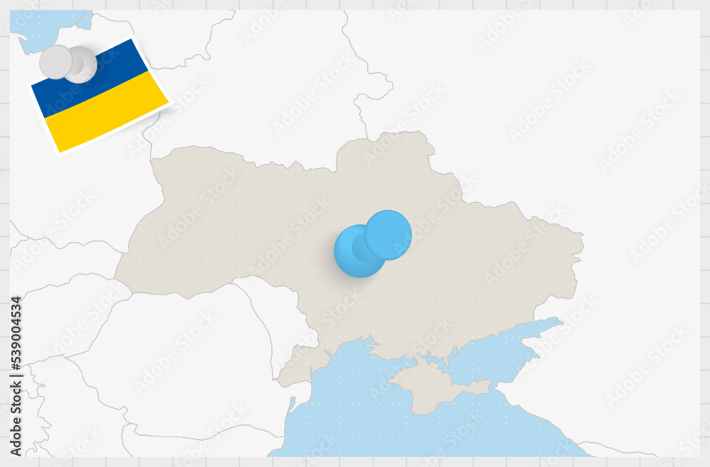 Map of Ukraine with a pinned blue pin. Pinned flag of Ukraine.