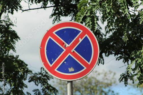 Road sign with bullet holes in the city of Bucha