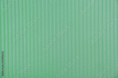 Green striped waved polyurethane foam background