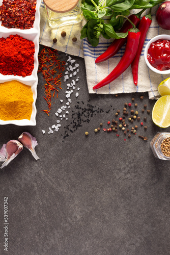 Vegetables with herbs and spice at stone background table. Natural healthy homemade food concept
