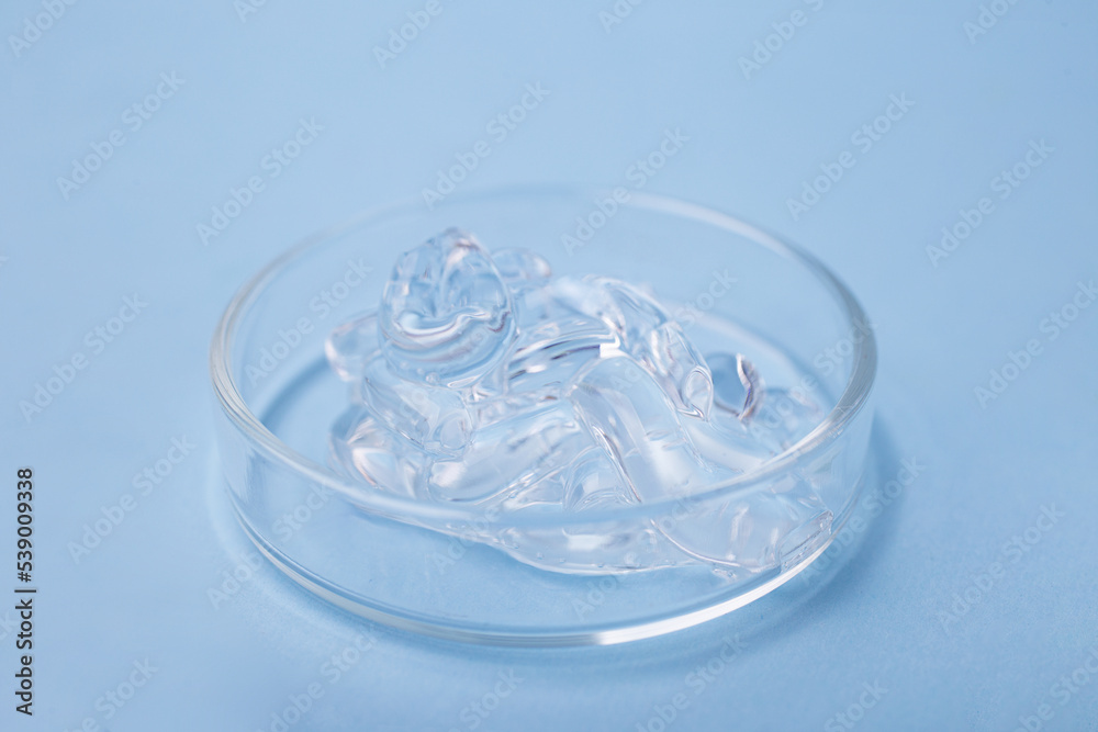 Closeup photography of cosmetic gel with bybbly structure in petri dish.
