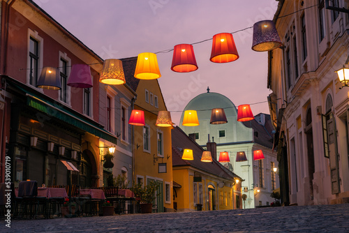 Main square with beautiful city lights in Szentendre Hungary next to Budapest with colorful banner light decorations