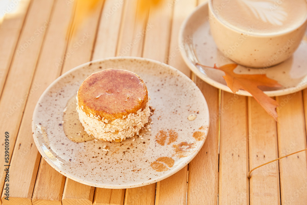 Fototapeta premium Vegetarian healthy no baking and no sugar carrot dessert with agave syrup. Gluten free cake with cup of coffee