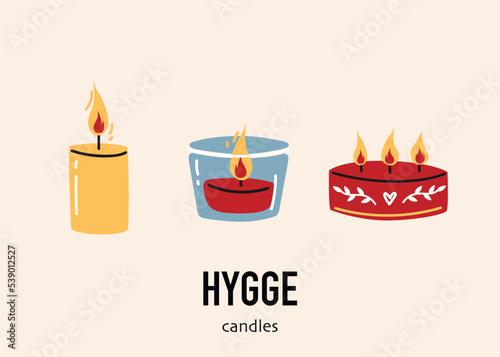 Set of burning decorative wax or paraffin candles isolated on light background. Home fragrances cute hygge home decoration