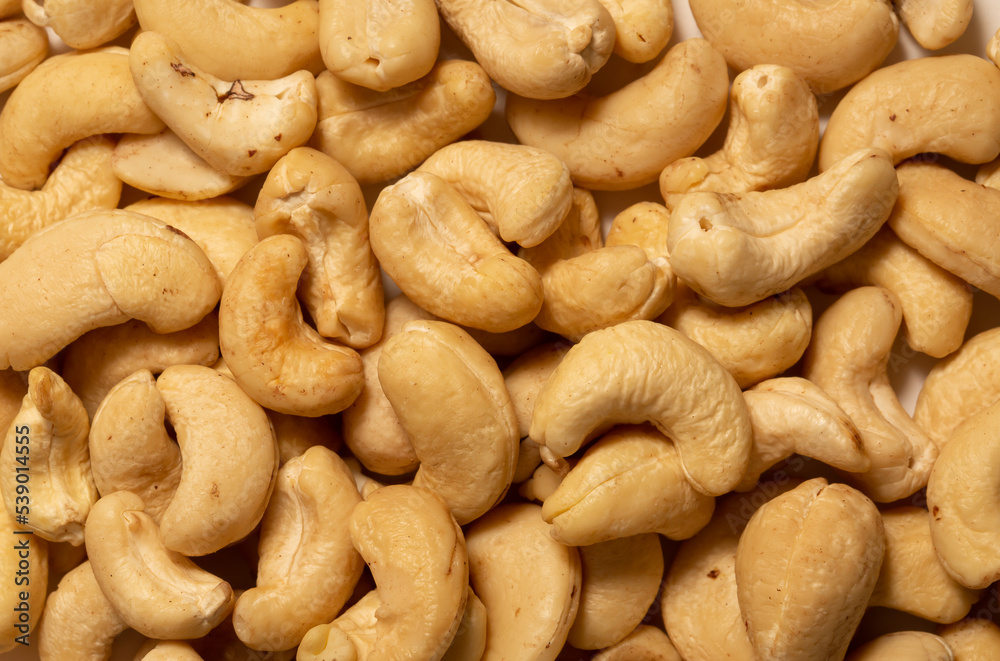 Cashew nuts as a background, top view. Cashew isolated on white background. Healthy foods. Cashew nuts as a background, top view. Cashew isolated on white background. Healthy foods.