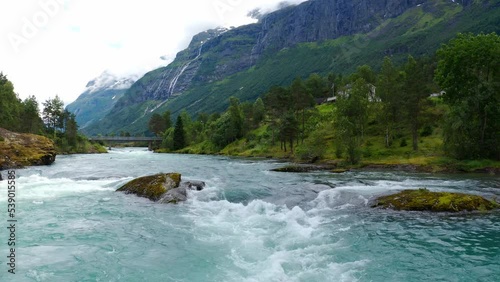 Stryn village and blue lake, beautiful nature of Norway lakes and mountains, Aerial photo