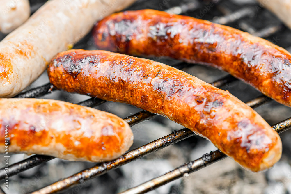 Marinated grilled sausages are fried on a fire. Marinated grilled sausages are fried on a fire.