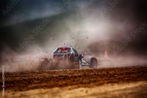 Racing sports car in dust clubs on the track , rally 