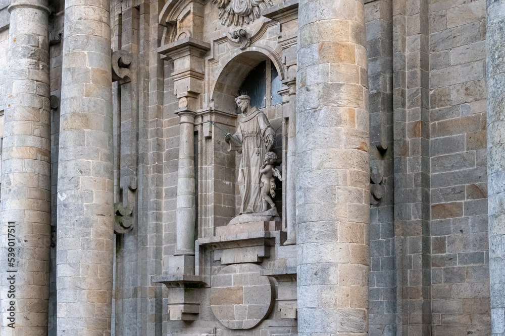 High columns and image. Facade of the Church of San Francisco, Santiago de Compostela, Galicia, Spain. Santiago's road.