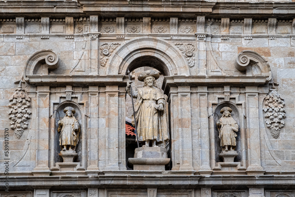Image of Santiago and the disciples Atanasio and Teodoro. East facade, Puerta del Perdón or Santa, Cathedral of Santiago de Compostela, Galicia, Spain.