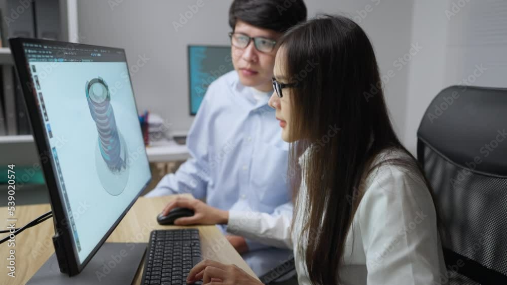 Asian architecture using 3d program to design building prototype. They are trying to develop modern building together. Asian architecture using 3d program to design building prototype. They are trying to develop modern building together.