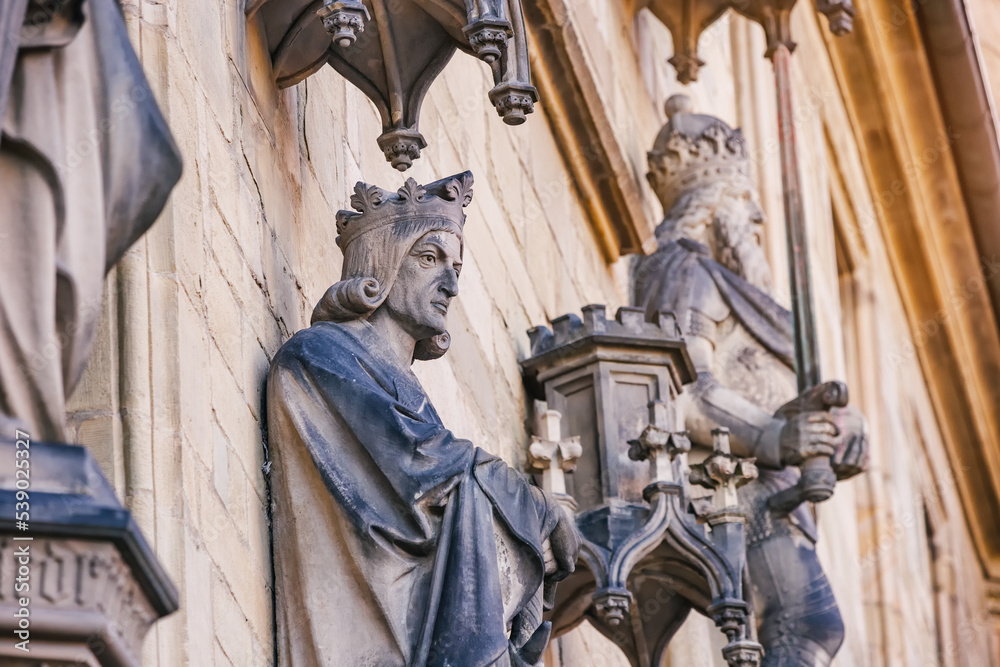 Ancient sculptures and statues on the facade of the town hall of the old town of Osnabruck with warriors and royal nobility