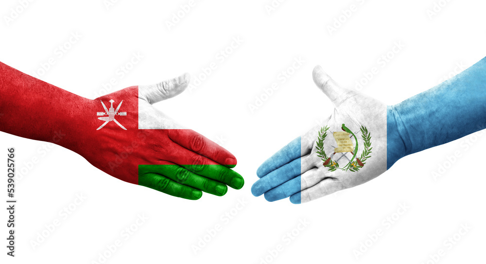 Handshake between Guatemala and Oman flags painted on hands, isolated transparent image. Handshake between Guatemala and Oman flags painted on hands, isolated transparent image.