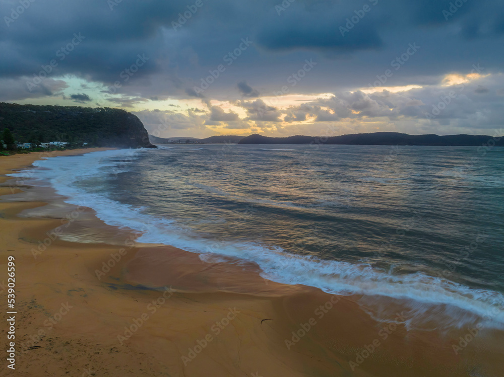 Sunrise seascape with overcast sky and rain clouds Sunrise seascape with overcast sky and rain clouds