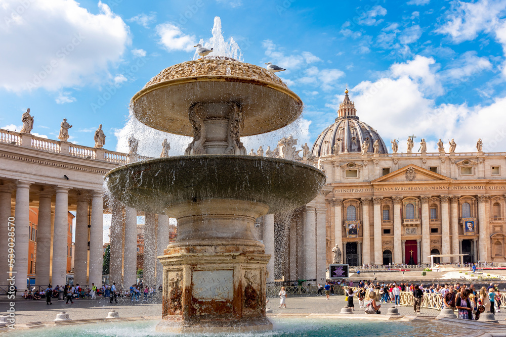 Fountain on St. Peter`s square and St. Peter's basilica, Vatican