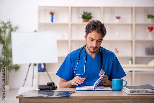 Young male doctor working in the clinic © Elnur