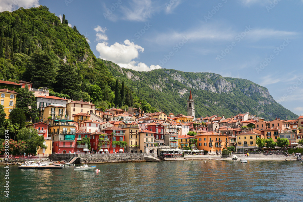 Colorful Varenna Town with Green Mountains. Picturesque Italian Comune with Lake Como during Summer Day.