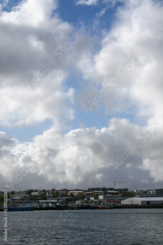 Reykjavik, Iceland - Reykjavik’s coastline, under a cloudy blue sky. Image has copy space. © Dana