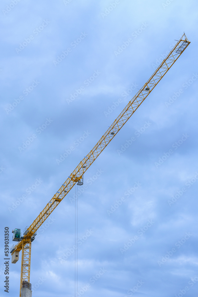 yellow crane on a construction site yellow crane on a construction site