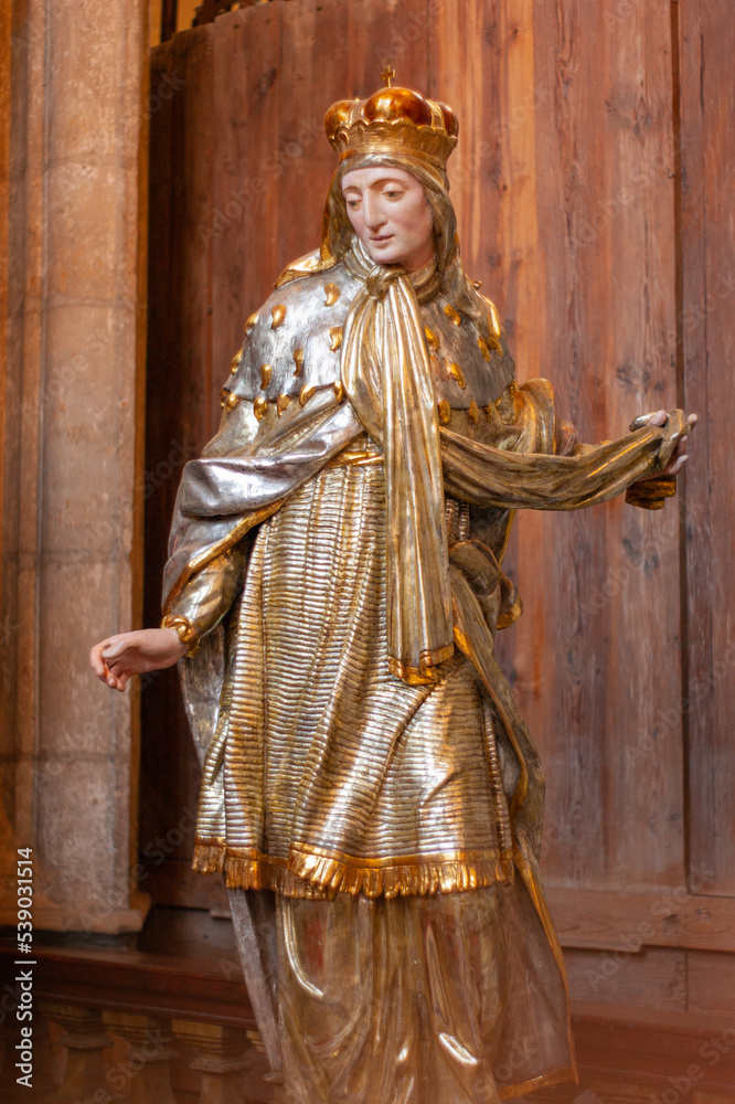Statue of a saint inside the miners church ,Saint Barbara, in Kutna Hora, Czech Republic, Bohemian area. Dressed image in silver and gold with ermine shawl.