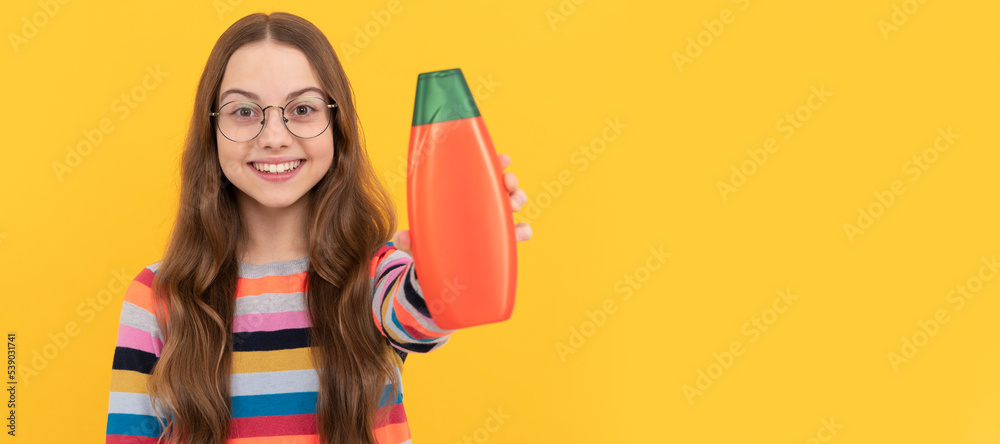 daily habits and personal care. skin lotion care beauty. showing cosmetic product for teen. Banner of child girl hair care, studio poster header with copy space. daily habits and personal care. skin lotion care beauty. showing cosmetic product for teen. Banner of child girl hair care, studio poster header with copy space.