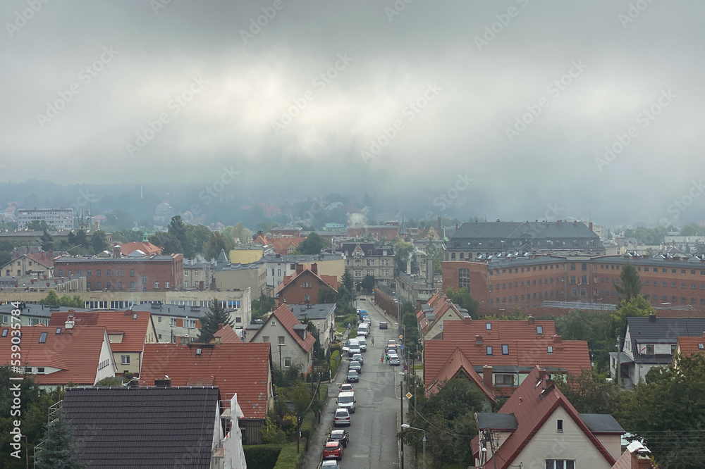 Fog over the autumn old town in Poland