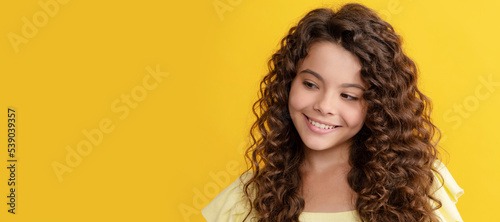 happy teen girl with long curly hair and perfect skin, hair. Child face, horizontal poster, teenager girl isolated portrait, banner with copy space.