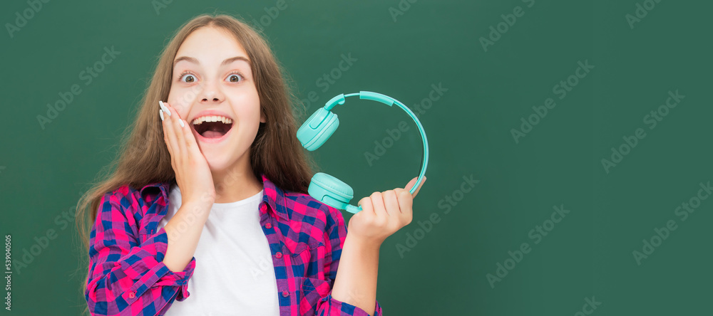 listen to music. wireless headset device accessory. new technology. childhood development. Horizontal isolated poster of school girl student. Banner header portrait of schoolgirl copy space.