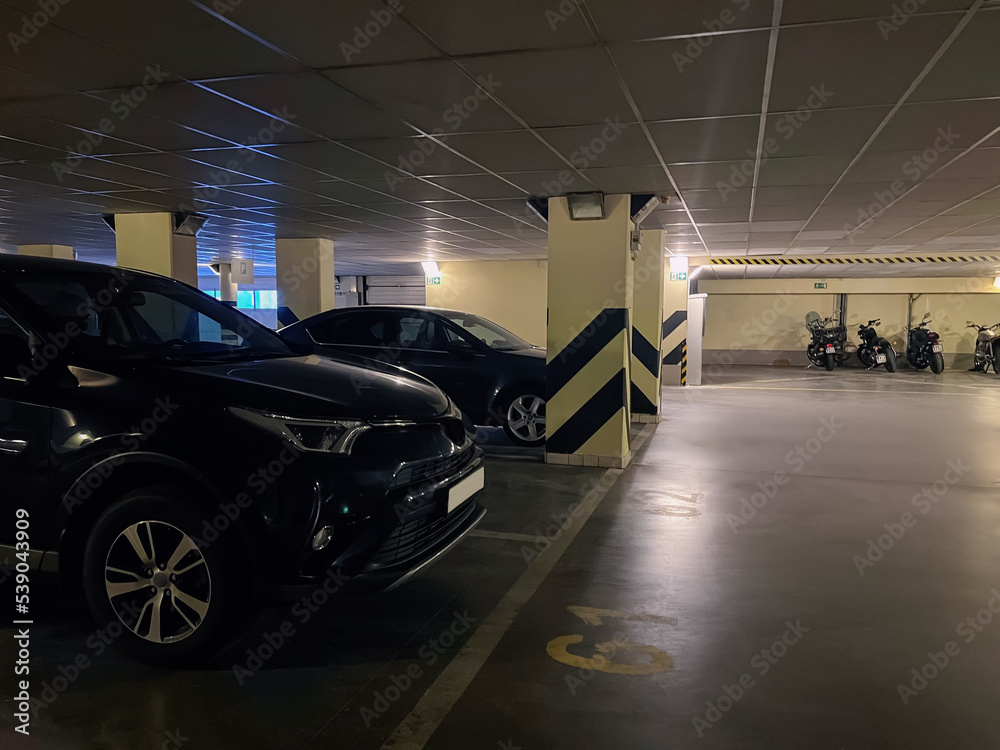 View of different vehicles in underground parking View of different vehicles in underground parking