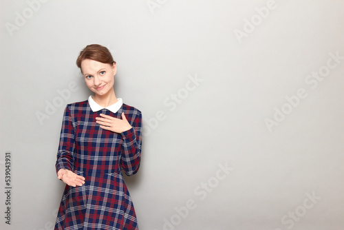 Принти на полотні Portrait of young woman feeling respect and expressing gratitude