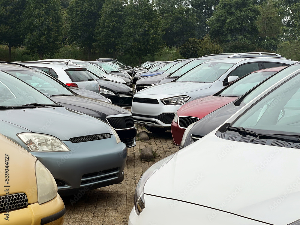View of many different cars in parking lot