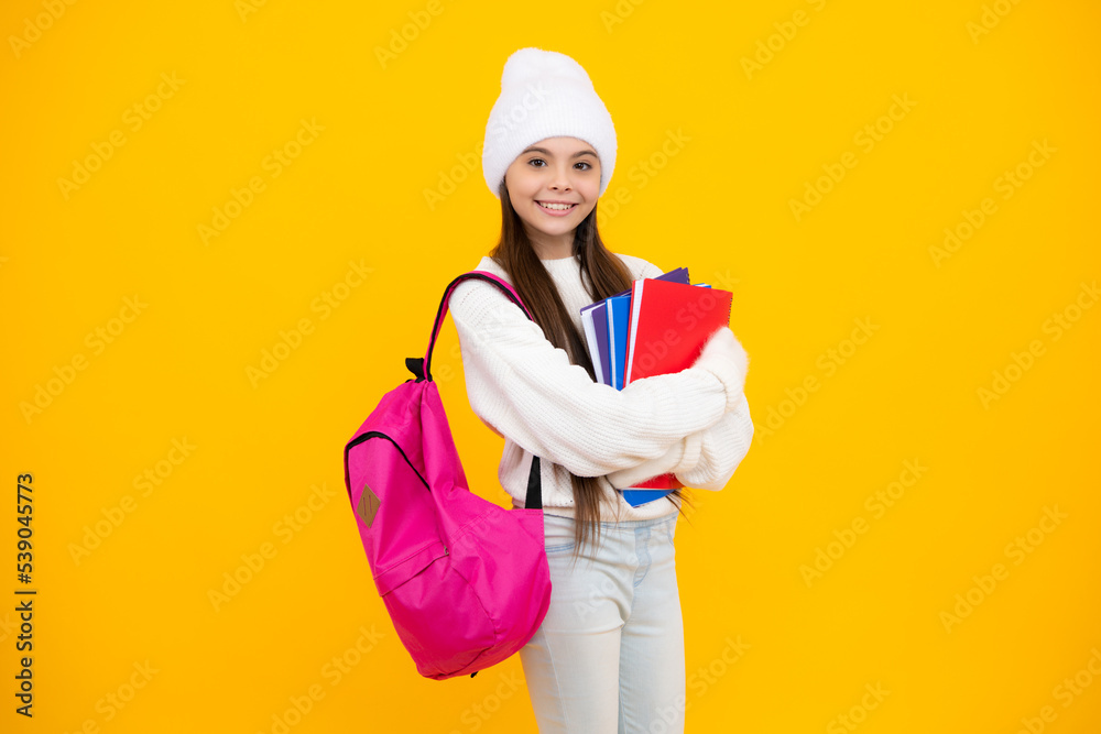 Autumn school. Teenager school girl with backpack in autumn clothes on yellow isolated studio background. Autumn school. Teenager school girl with backpack in autumn clothes on yellow isolated studio background.