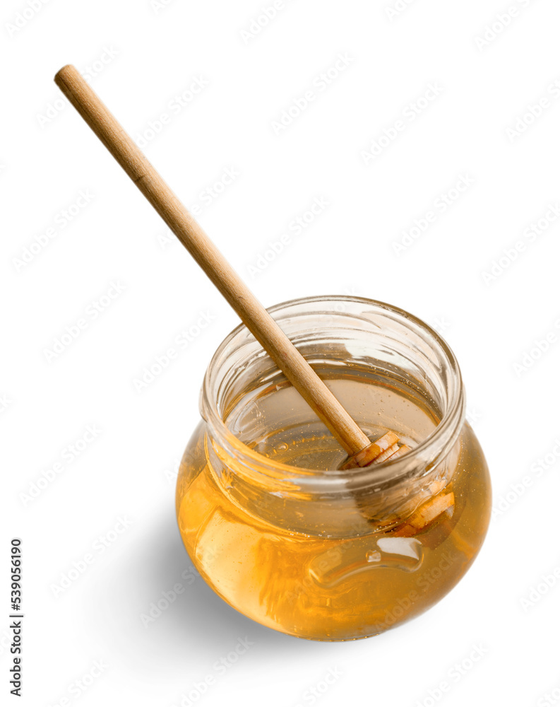 Honey in glass jar and honey dipper Honey in glass jar and honey dipper