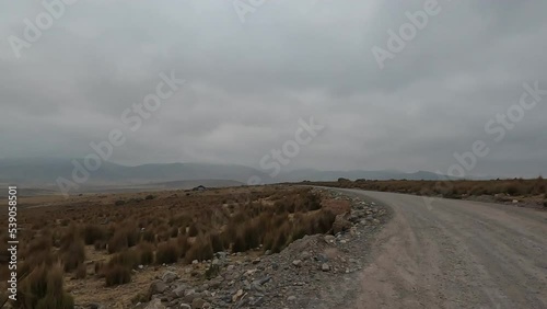 Road trip in the Peruvian Andes. High altitude mountains trip by car crossing the Andean country side. 