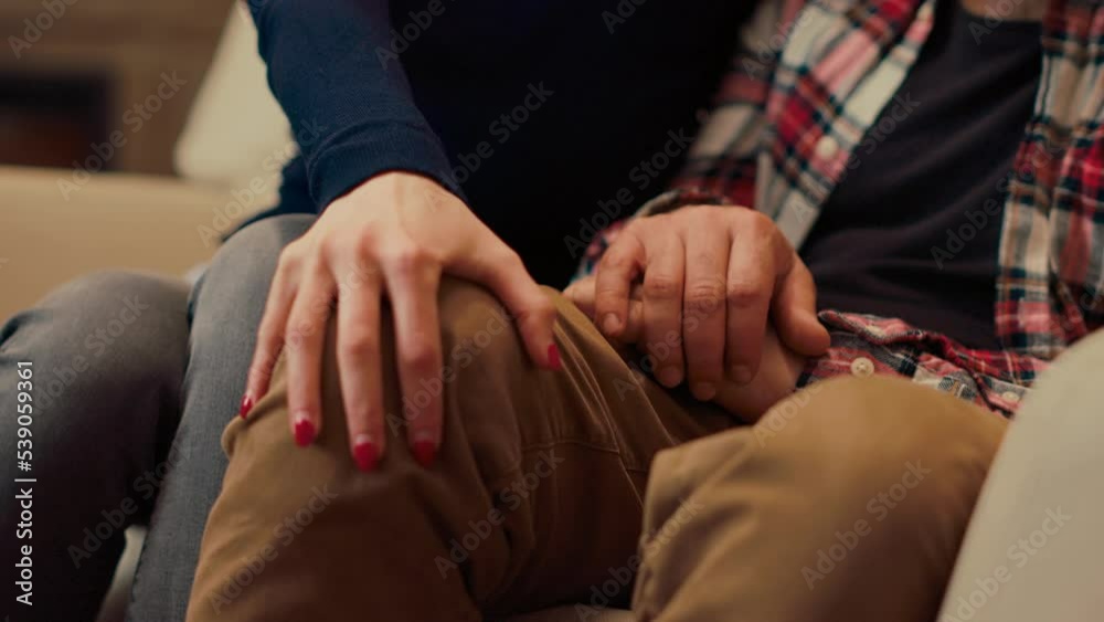 Married couple holding hands after reconciliation at couple therapy session, feeling happy about making peace. Resolving marriage problems with psychotherapist. Close up. Handheld shot. Married couple holding hands after reconciliation at couple therapy session, feeling happy about making peace. Resolving marriage problems with psychotherapist. Close up. Handheld shot.